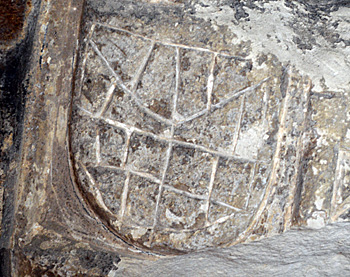 Graffito on the south door stoup April 2015